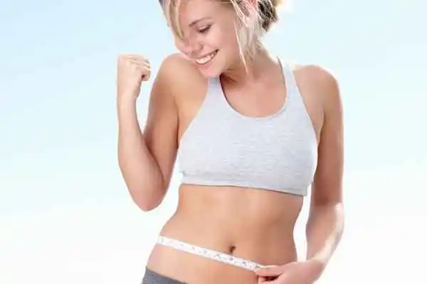 woman happy after fat reduction treatment North Kensington