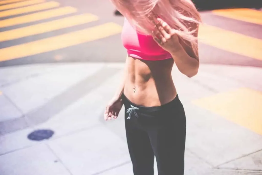 Woman with toned stomach after LA-EMS Body Sculpting Treatment North Kensington